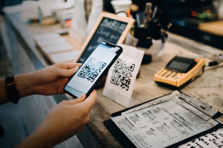 ey customer scanning qr code making contactless payment in a cafe Gold Coast Digital Marketing Agency