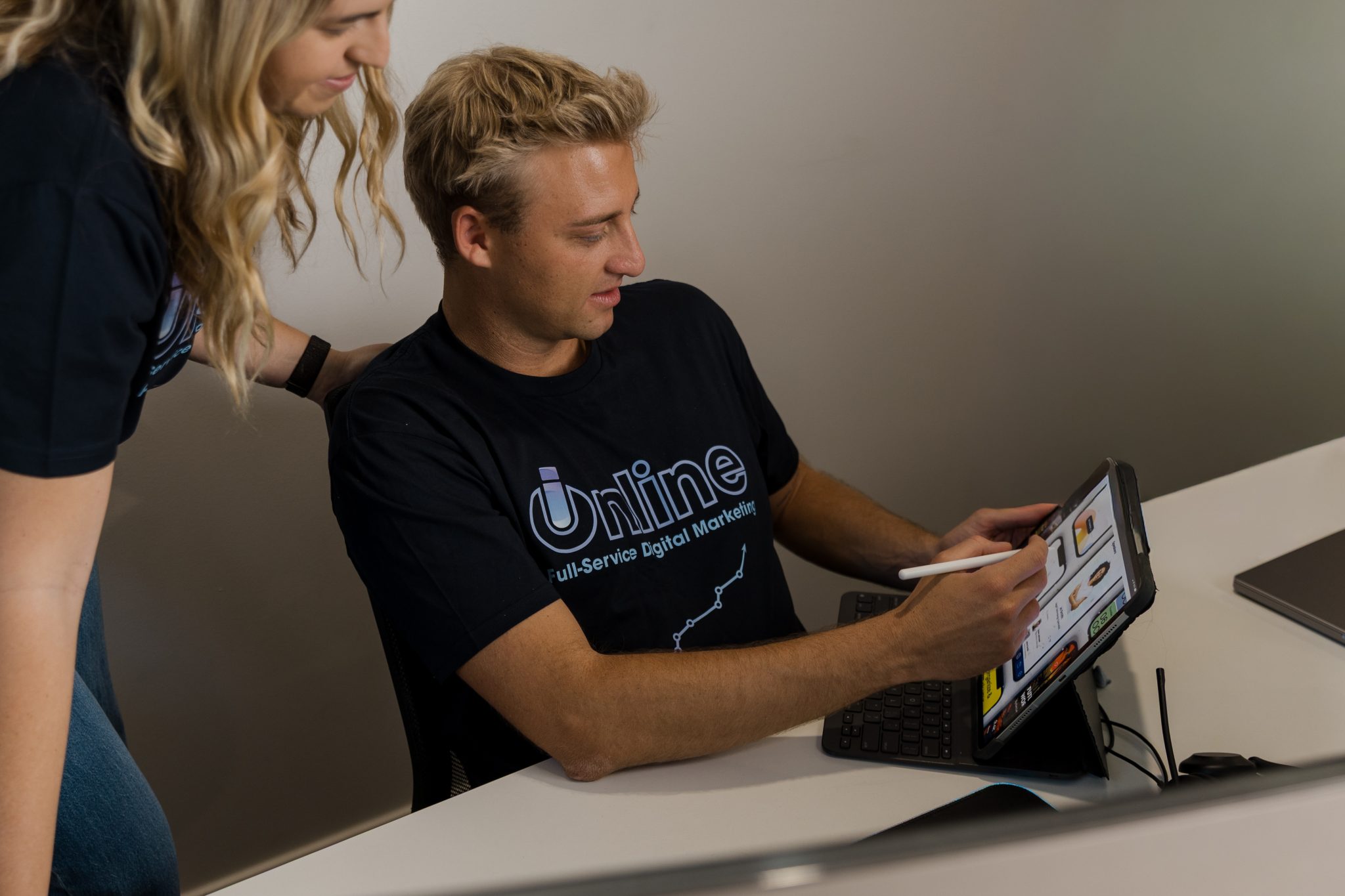 UI/UX team collaborating on iPad website design