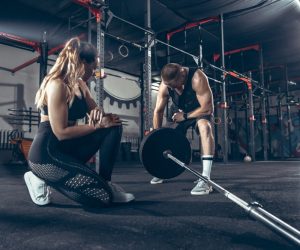 athletic-man-woman-with-dumbbells
