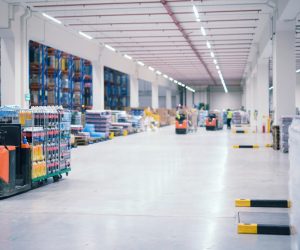 warehouse-industrial-building-interior-with-people-forklifts-handling-goods-storage-area